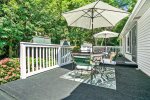Amazing back deck with multiple seating areas for outdoor dining